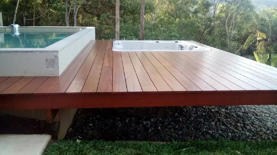 Poolside timber deck in Cairns restored with a warm stain