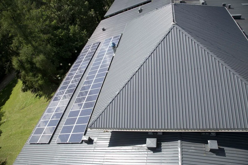 Aerial view of a freshly sprayed grey metal roof on a Cairns home